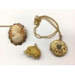 9ct gold mounted cameo brooch, 9ct gold hedgehog charm and 9ct gold locket on chain