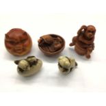 Five Japanese carved box wood and resin netsukes