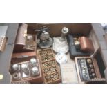 Box of miscellaneous items to include a pocket watch stand, clock parts/balance wheels, scent bottle