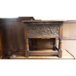 Carved oak box stool with hinged lid on turned and block legs joined by stretchers, together with an