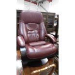 Contemporary leather reclining armchair with matching footstool