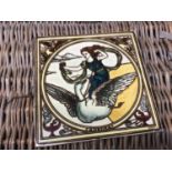 A Victorian Arts and Crafts ceramic tile entitled 'Aurora', depicting a classical figure riding a sw