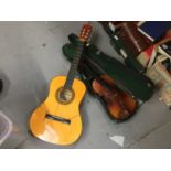 A Hearld Classical Guitar, together with a students violin and bow in case (2)