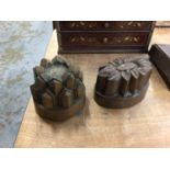 Two Victorian copper jelly moulds, 16.5cm and 14cm wide