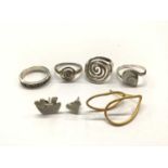 Pair of yellow metal loop earrings (stamped K18), pair of white metal studs and four silver (925) ri