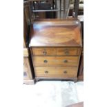 Edwardian inlaid mahogany bureau with fitted interior above two short and two long drawers