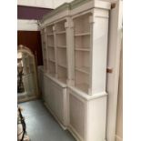 Georgian style white and green painted two height breakfront bookcase with adjustable shelves above,