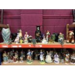 Mixed lot of foreign figurines and animals (2 shelves)