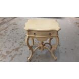Contemporary cream side table with shaped top and single drawer on cabriole legs, 60cm wide, 48cm de