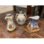 A pair of Royal Bayreuth China handled vases, transfer printed with scenes of children playing, hall