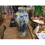 Chinese blue and white vase with character marks to base.