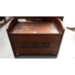Edwardian Arts & Crafts carved oak box stool with hinged seat and iron ring handles