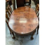 Edwardian walnut extending dining table with one extra leaf on cabriole legs with claw and ball feet