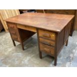 Mid 20th century oak twin pedestal desk with five drawers, 137cm wide, 81.5cm deep