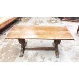 Oak refectory style coffee table on carved cup and cover end standards joined by stretcher, 107cm wi