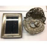 Silver photograph frame and a silver inkwell stand with lid (lacking the glass inkwell)