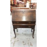 Oak bureau with two drawers below on cabriole legs, 76cm wide, 40cm deep, 106cm high