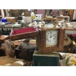 Brass carriage clock in leather travelling case.