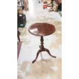 19th century tilt top wine table raised on pad feet