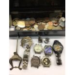 Various wristwatches, coins and sundries within a black lacquered box