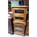 Pair of bedside chests of three drawers with bevelled glazed fronts
