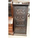 Antique heavily carved oak hall cupboard with two drawers below, 85cm wide, 47cm deep, 175cm high