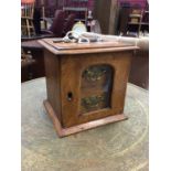 A small oak two drawer cabinet with glass front and brass handles (key present), 21cm high x 21cm wi