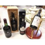 Four bottles of port to include House of Commons, Cockburn's, Graham's and Warre's 1983 vintage port
