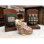 A pair of carved and painted armorial bookends, and a Royal Crown Derby walrus