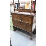 Early 20th century mahogany cabinet with ledge back, two panelled doors and three drawers below on c