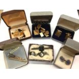 Group of cufflinks and tie clips including silver and gold plated