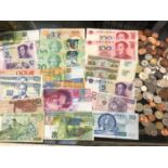 Collection of world banknotes and various coins