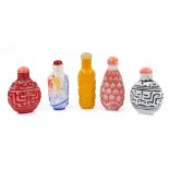 Collection of five Peking glass snuff bottles and stoppers