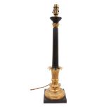 Antique Empire style bronze and ormolu table lamp, with fluted column and tooled circular base on sq