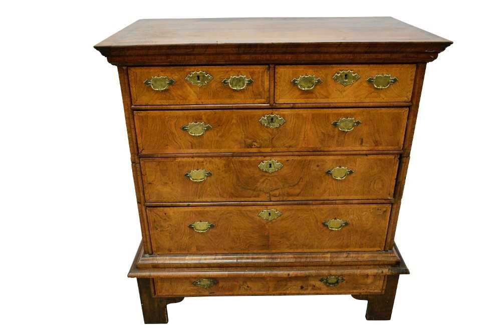 Early 18th century walnut and feather banded chest on stand