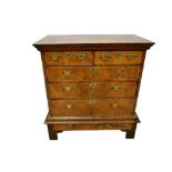 Early 18th century walnut and feather banded chest on stand