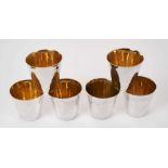 Set of six contemporary silver spot hammered beakers with gilded interiors