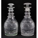 A near pair of Georgian cut glass three-ring decanters, with diamond and facet-cut patterns, mushroo