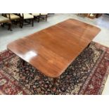 19th century mahogany concertina action extending dining table with three extra leaves