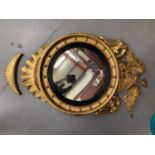 Regency gilt convex wall mirror with eagle cresting