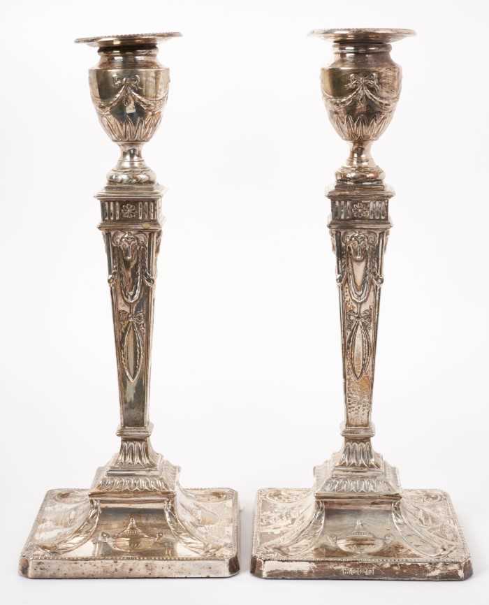 A pair of Edwardian silver candlesticks