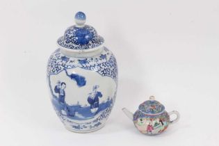 A 19th century Chinese blue and white porcelain vase and cover, decorated with figural scenes, 23cm