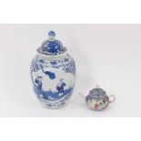 A 19th century Chinese blue and white porcelain vase and cover, decorated with figural scenes, 23cm