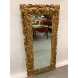 Good quality late 19th century carved giltwood framed wall mirror with bevelled plate 145 cm x 72 cm