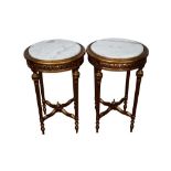 Pair of French style giltwood tables with circular white marble tops