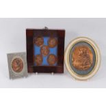Framed set of five 19th century embossed copper medallions, two others
