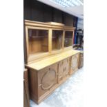 Early 20th century Continental golden oak two height sideboard with three glazed doors above enclosi