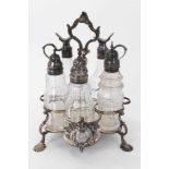 George III silver cruet stand, the glass bottles associated