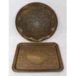 Two Islamic engraved brass trays