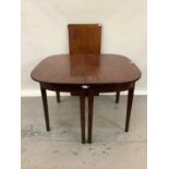 George III mahogany dining table with one additional leaf